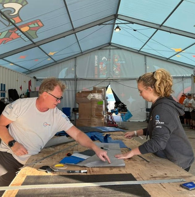 Nipper making her own one of a kind bag from retired sails of the IMOCA "Malama" of 11th Hour racing team