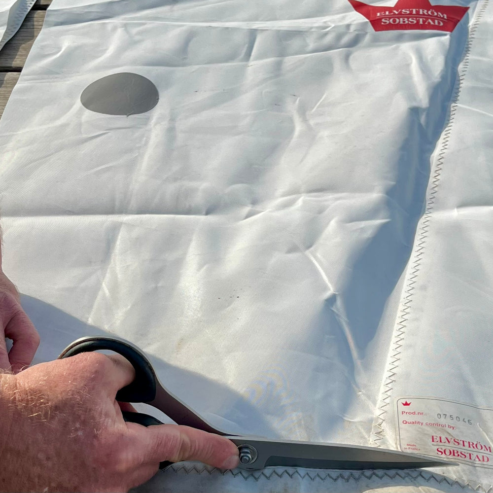 We leave as many details of the original sail as possible when we upcycle it into bags and accessories