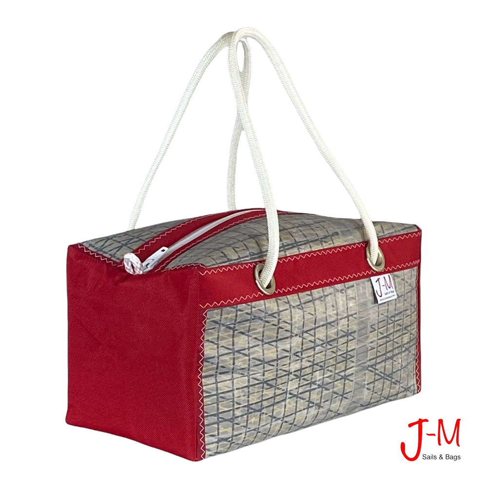 
            
                Load image into Gallery viewer, Duffel bag Bravo Small, grey sail / red canvas, handmade in Italy by J-M Sails and Bags 45° view
            
        
