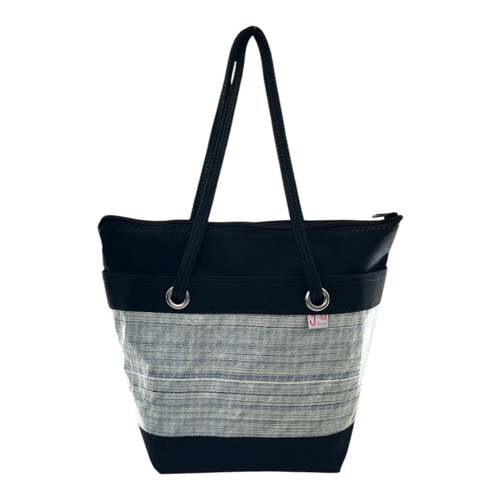 Meet Oscar – a refined update to our classic Lima design, now with a rectangular bottom for added structure and space. Handcrafted in Italy, this bag is made from an upcycled sail that competed in the America’s Cup events, giving it a unique blend of performance heritage and sustainable style.